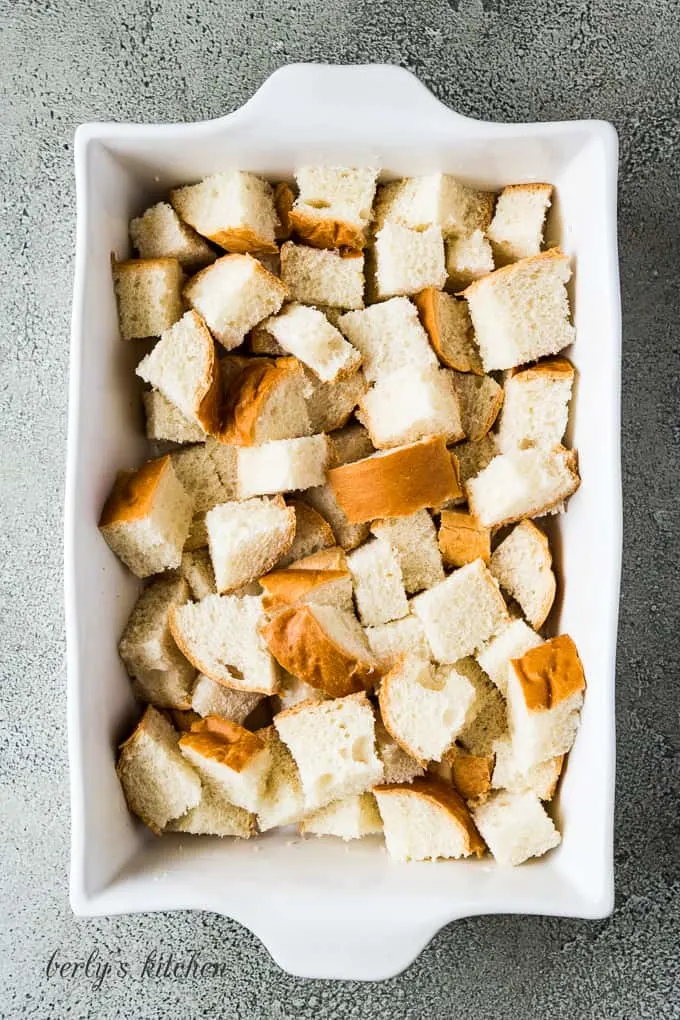 Chunks of bread have been added to the casserole dish.