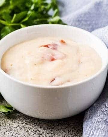 The cream of bacon soup substitute in small white bowl.