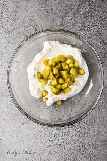Diced pickles have been added to the cream cheese mixture.
