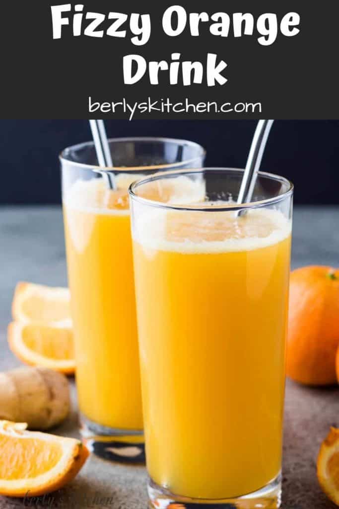 The fizzy orange drink served in glasses with colorful straws.