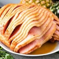 Spiral cut ham with a brown sugar glaze on a platter.