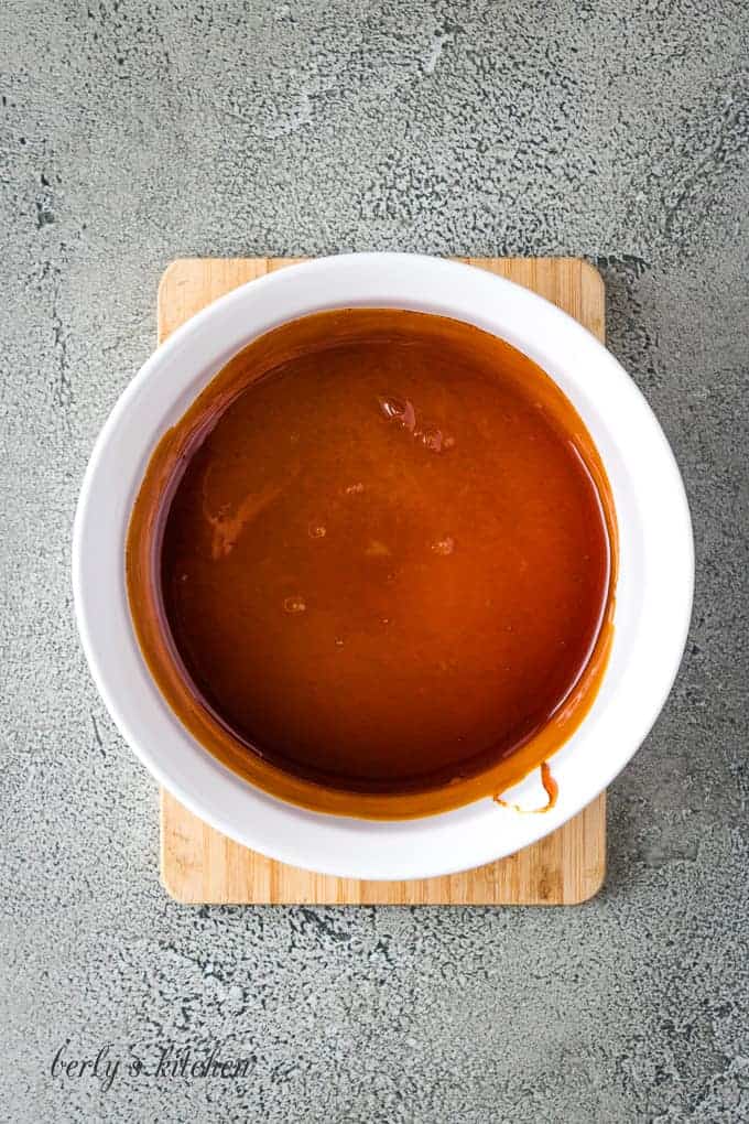 The caramel sauce has been transferred to a baking dish.