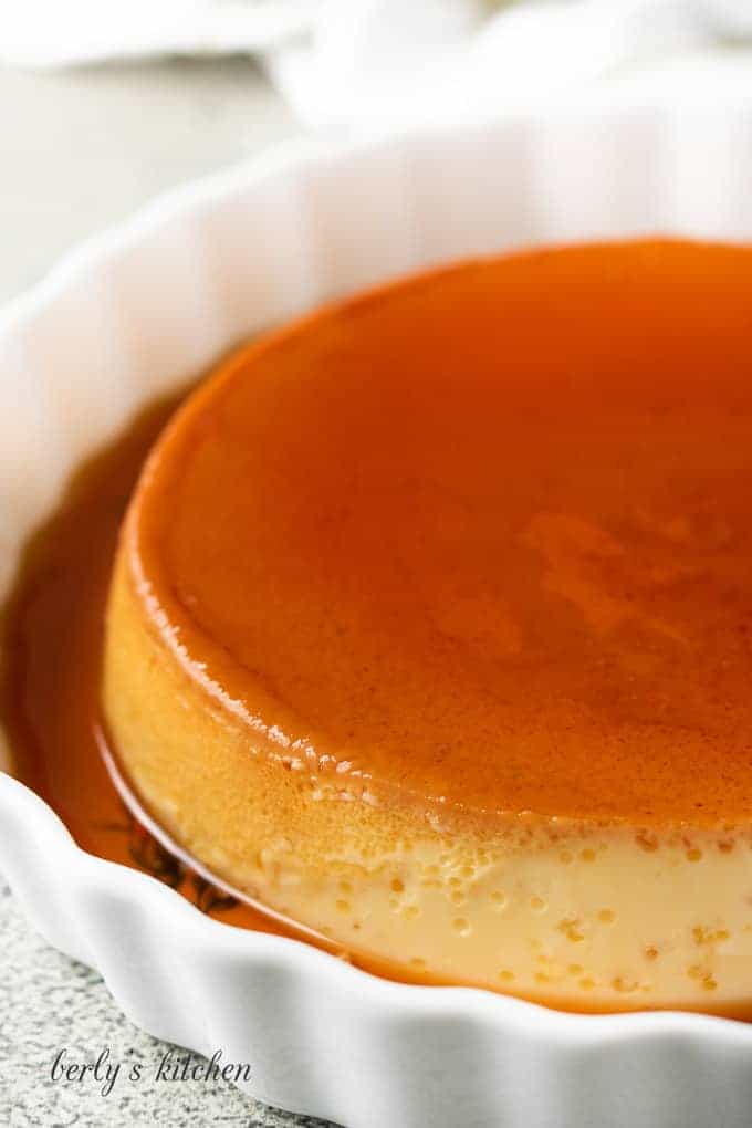 The finished flan in a tart pan with the sauce.