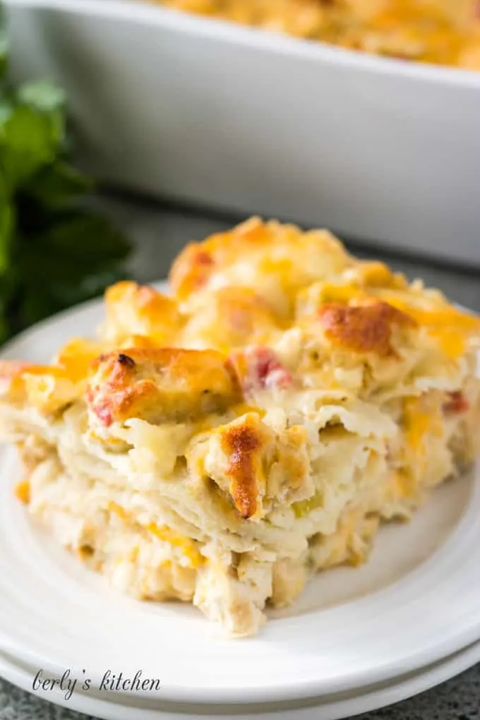 A generous portion of King Ranch chicken casserole on a white plate, ready to serve.