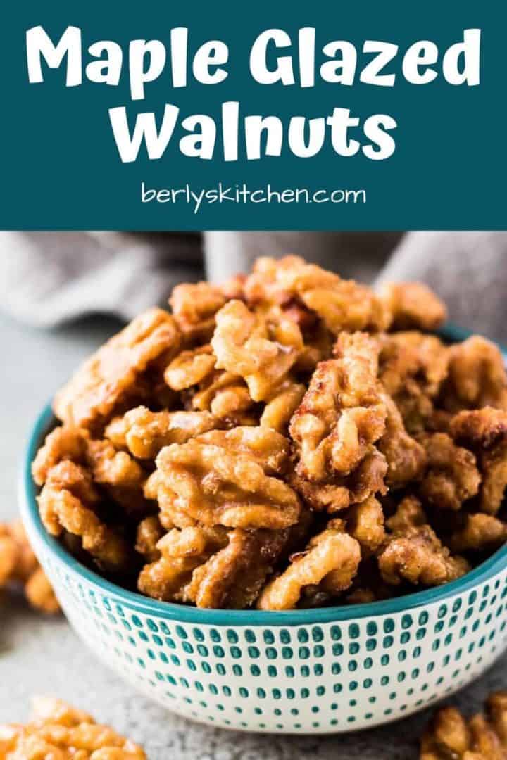 Maple glazed candied walnuts in a small decorative green bowl.