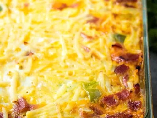 The baked cheesy breakfast casserole in a pan.