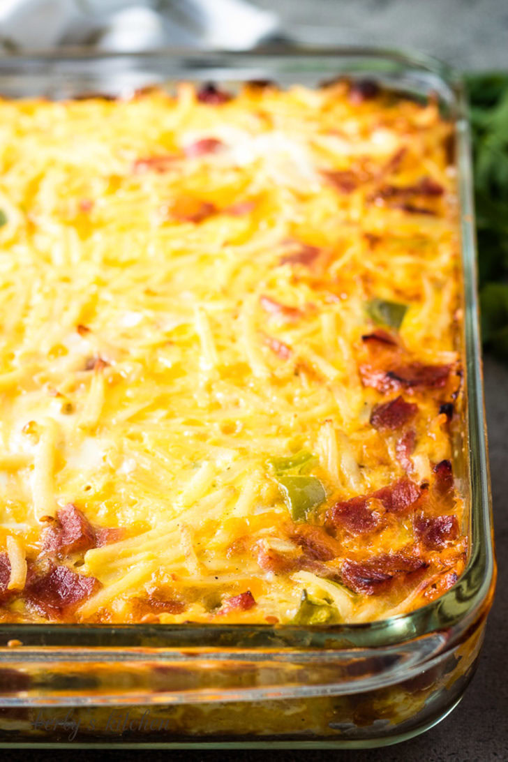 The baked cheesy breakfast casserole in a pan.