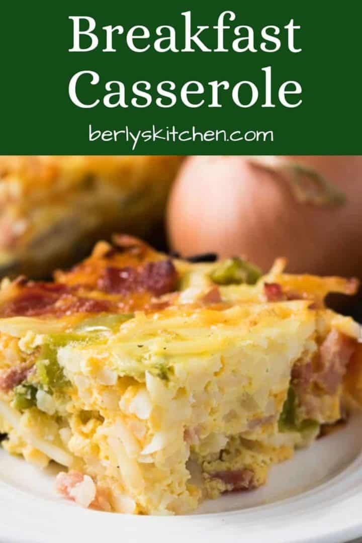 A slice of the cheesy breakfast casserole on a plate.