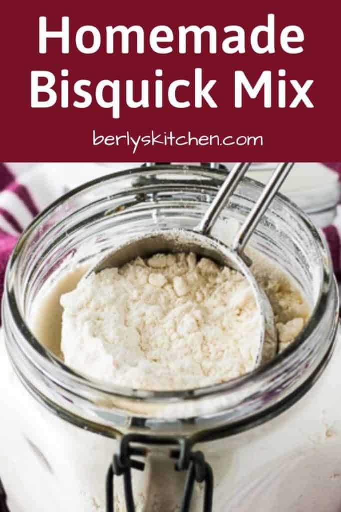 A scoop of the bisquick mix lifted from a mason jar.
