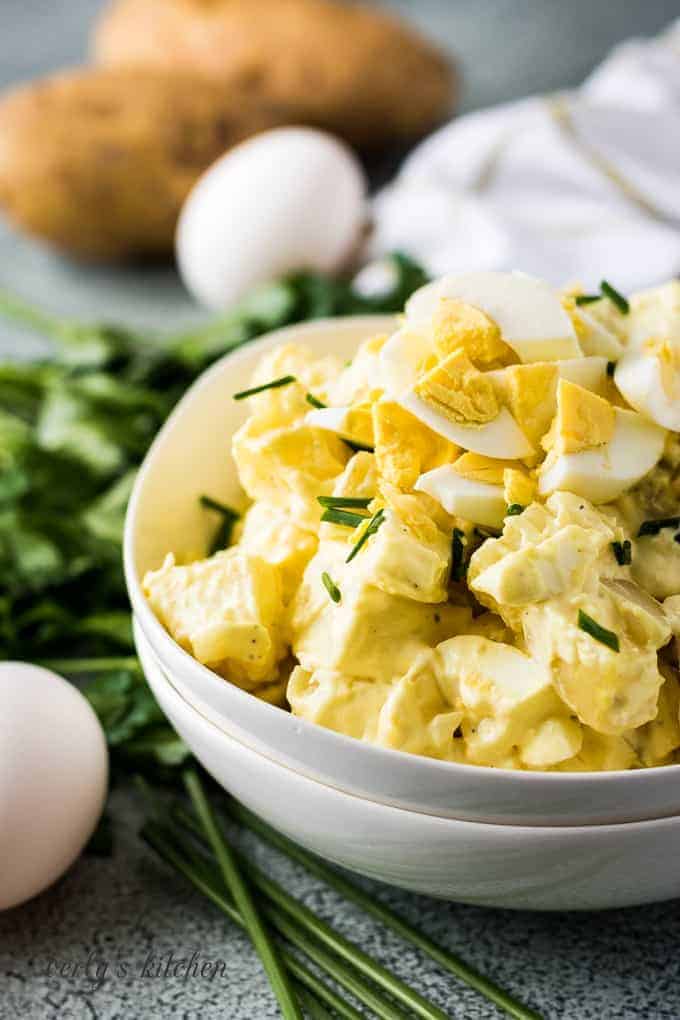 White bowl filled with potato salad.