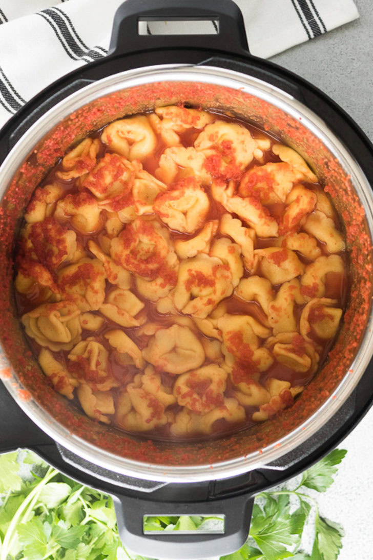 The pasta and tomatoes have pressure cooked in the liner.
