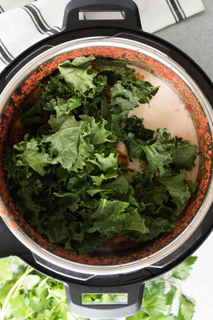 Kale and heavy cream added to the soup.