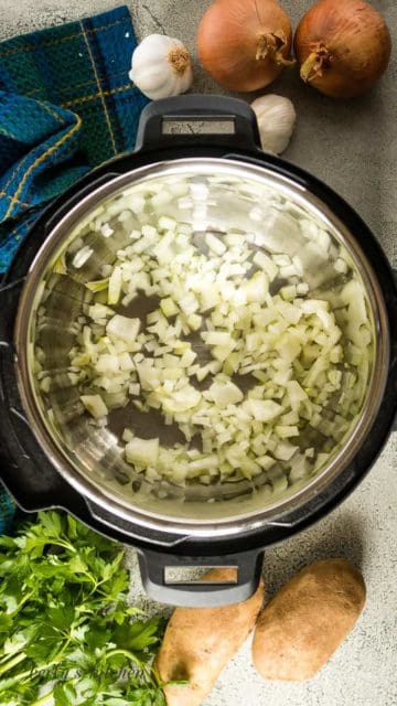 Chopped onions sauteing in the liner.