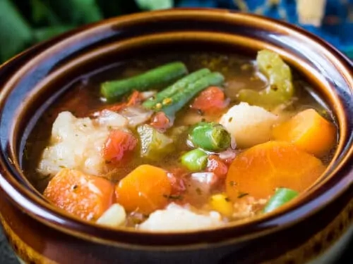 The finished instant pot veggie soup in a bowl.
