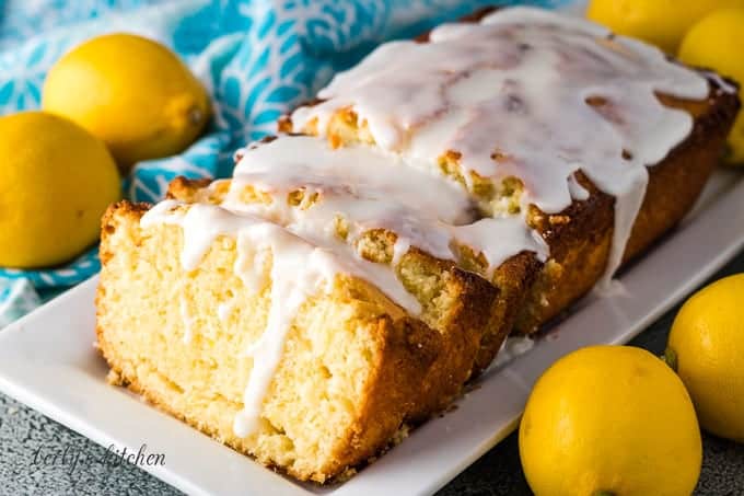 The sliced lemon quick bread drizzled with glaze.