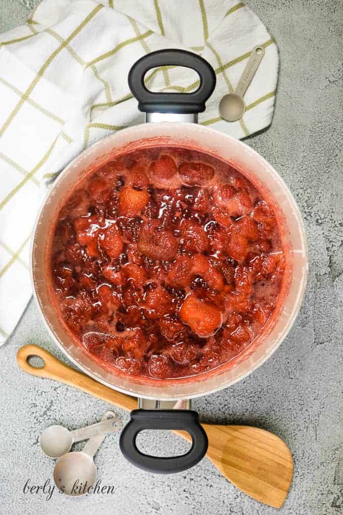 The homemade strawberry jam cooking.