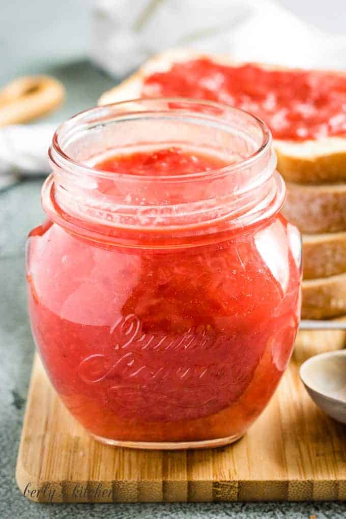The Sunday morning strawberry jam recipe served in a mason jar.