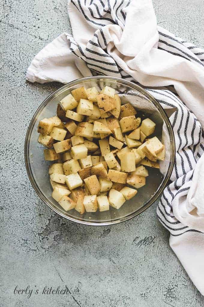 The potatoes have been tossed with olive oil and spices.