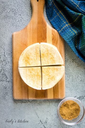 The quartered tortillas have been sprinkled with seasonings.