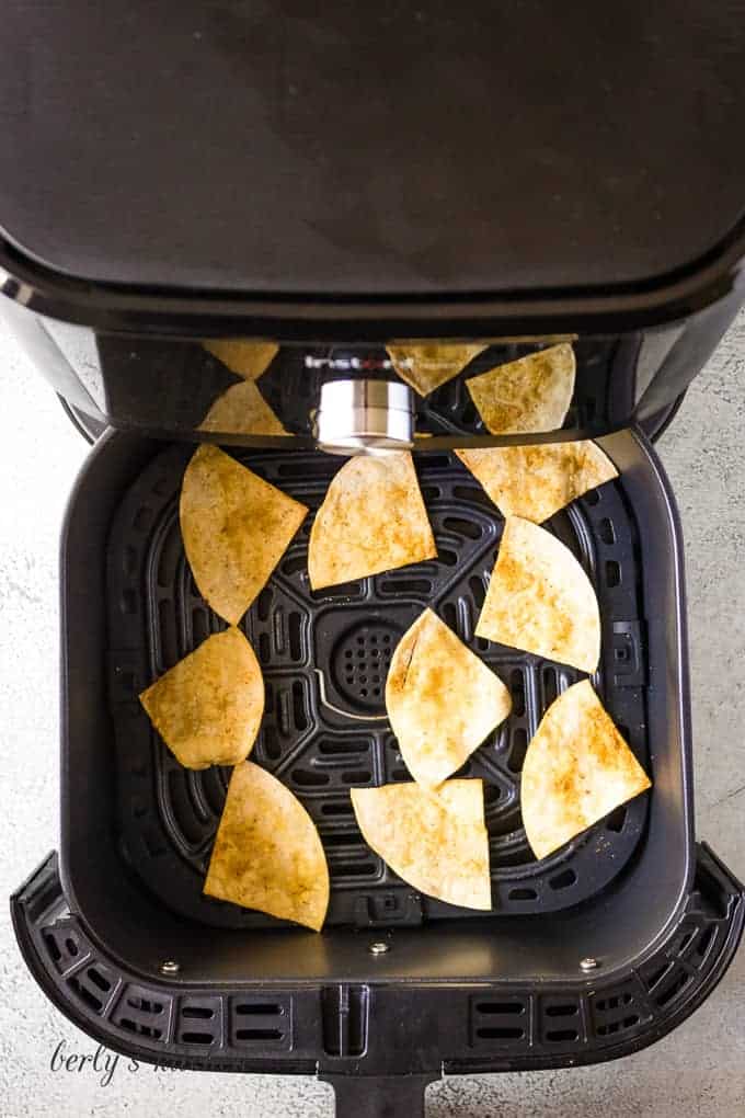 The chips have cooked in the fryer and are ready to serve.