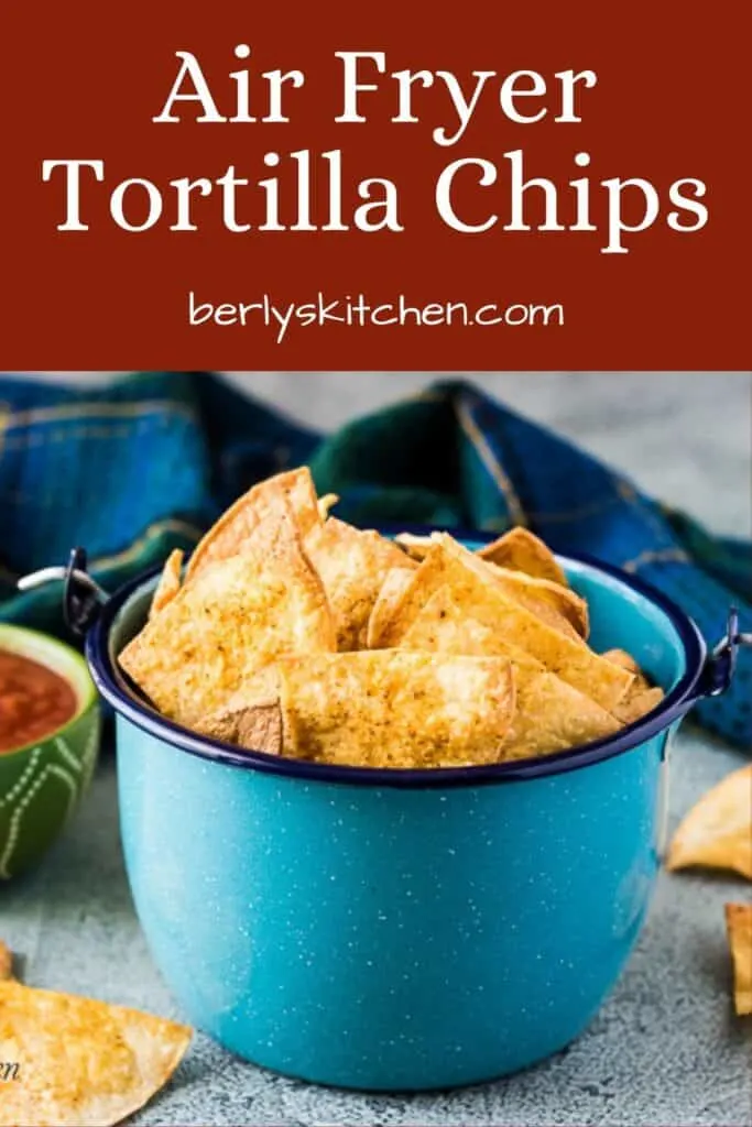 A blue kettle with wire handle filled with air fryer tortilla chips.