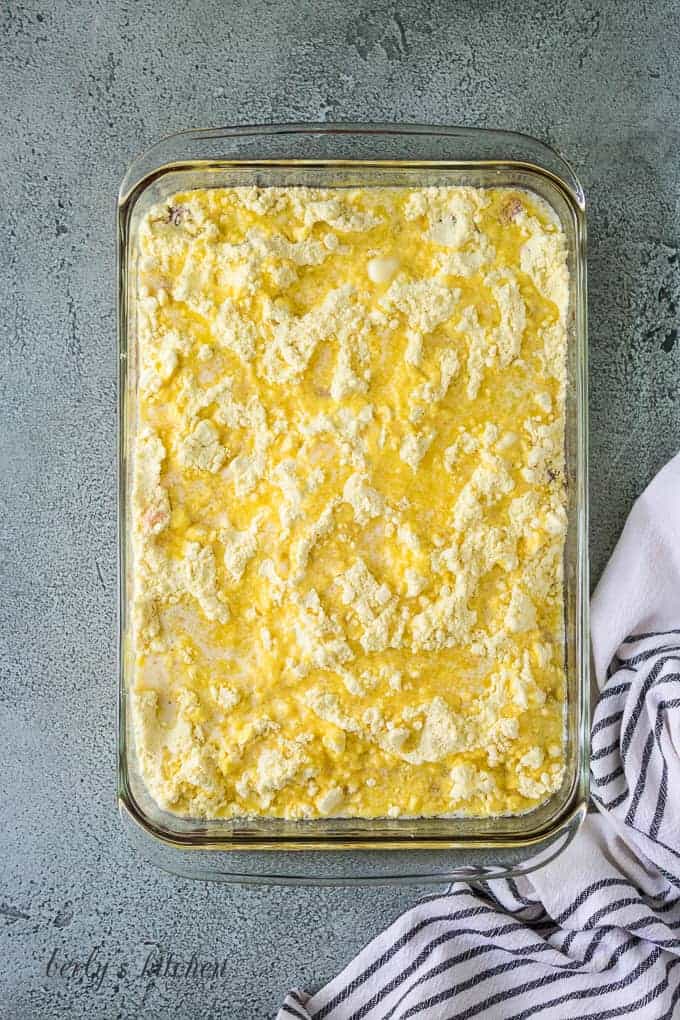 Melted butter has been drizzled over the cake mix.