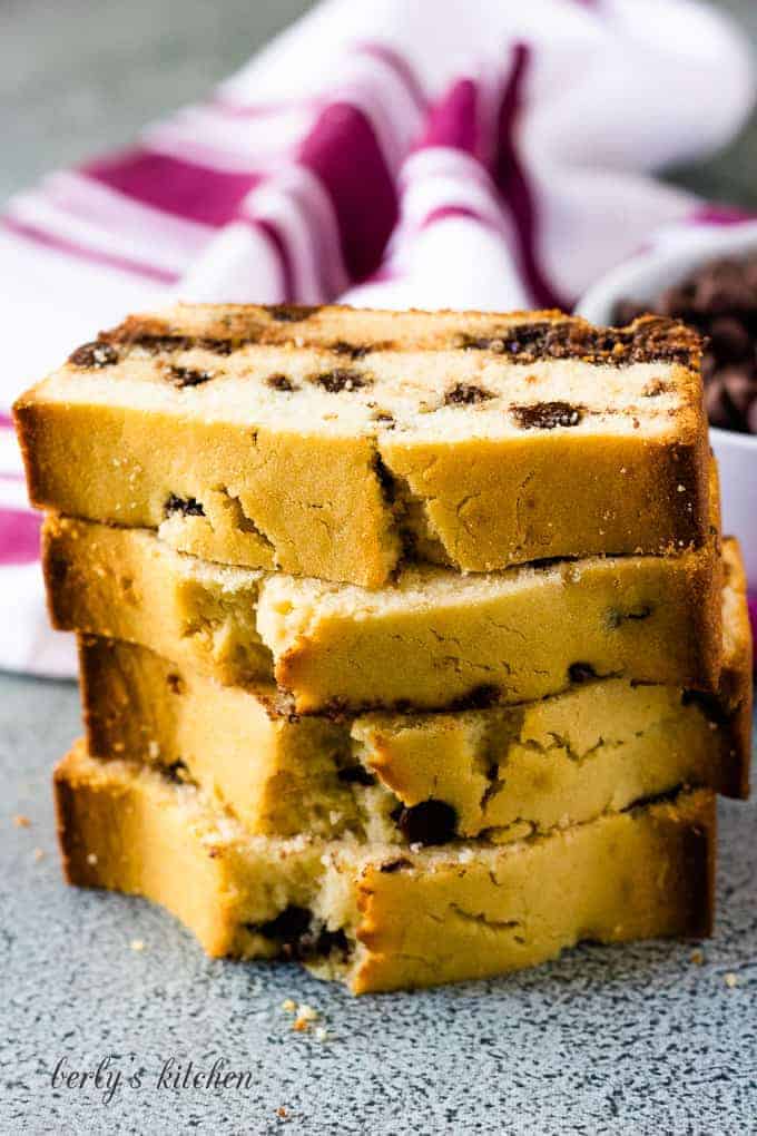 A stack of four slices of the finished loaf cake.