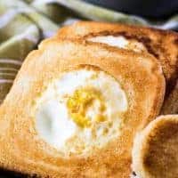A close-up of the eggs and toast on a plate.