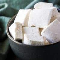 The square marshmallows served in a bowl.