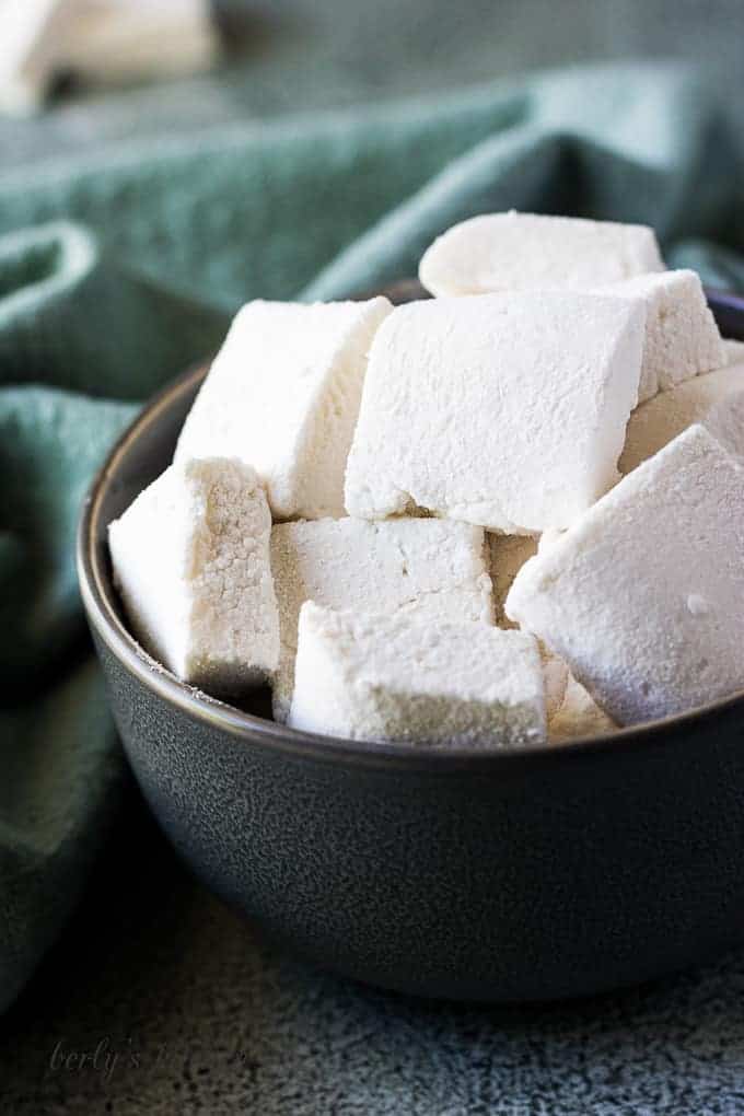 The square marshmallows served in a bowl.