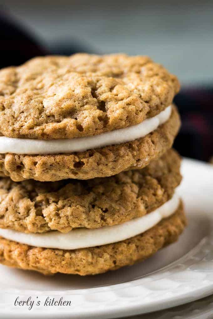 A close-up of the cookie sandwiches on a plate.