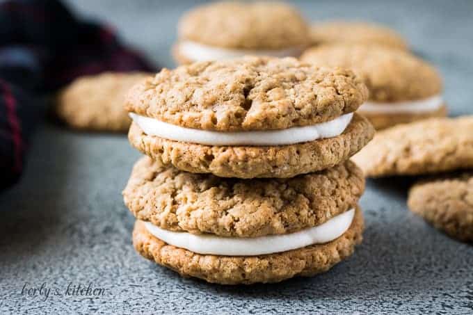 Two stacked oatmeal whoopie pies on the counter.