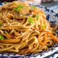 A close-up view of the veggie lo mein on a plate.