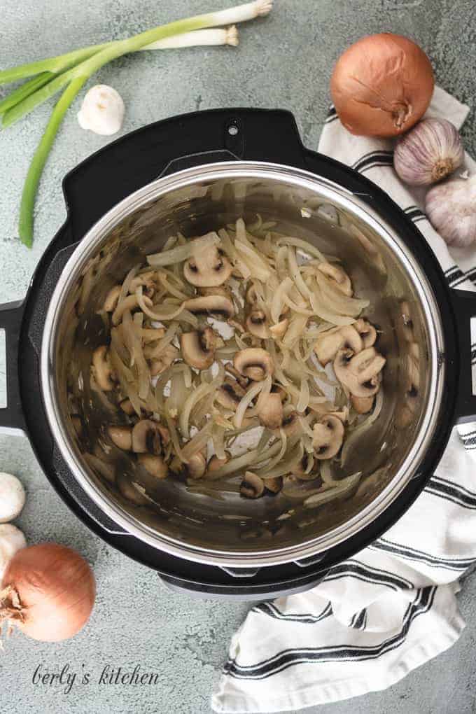 Mushrooms and onions sauteing in the instant pot.