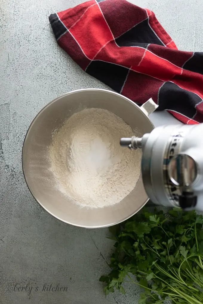 Flour and other dry ingredients in a stand mixer.