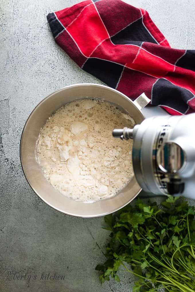 The yeast mixture has been added to the dry ingredients.