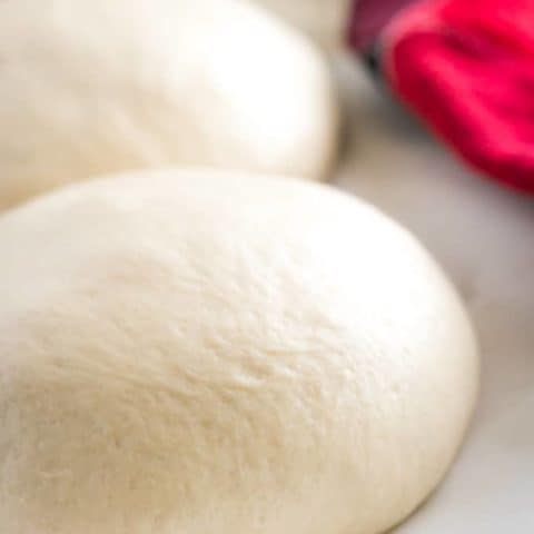 The dough has been separated into 2 big balls.