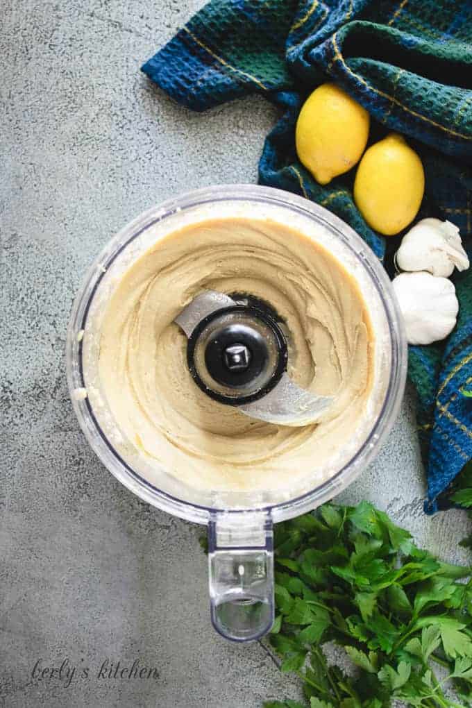 The roasted garlic hummus blended in a food processor.