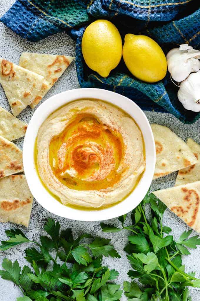 An aerial view of the roasted garlic hummus served with flatbread.