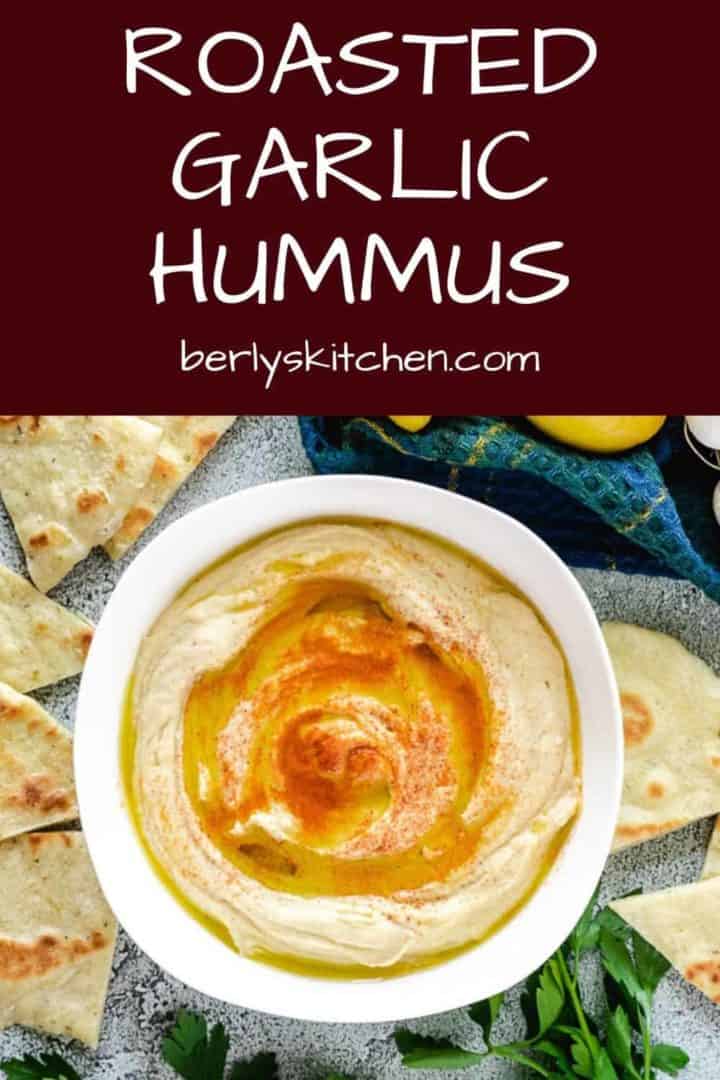 A top-down view of the roasted garlic hummus topped with smoked paprika.