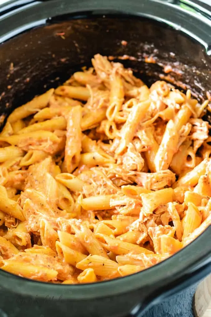 The cooked tomato pasta in the crock pot.