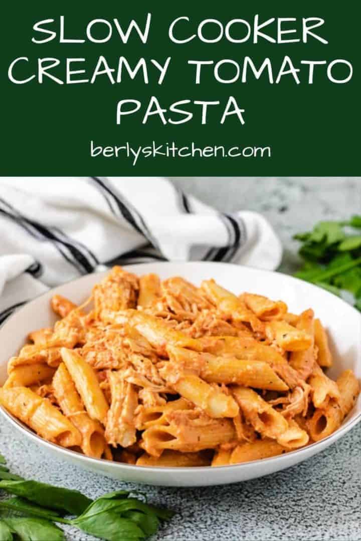 A decorative bowl filled with the slow cooker creamy chicken pasta.