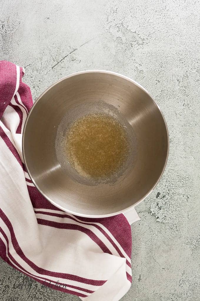 Gelatin and cold water in a stand mixer bowl.