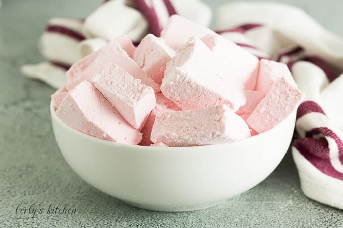 A large bowl filled with the homemade strawberry marshmallows.