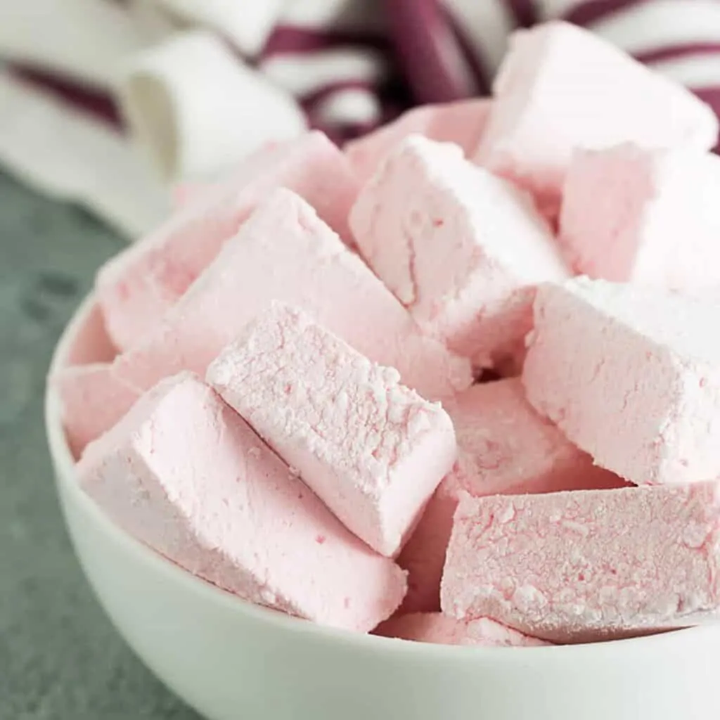 A close-up of the strawberry marshmallows in a bowl.
