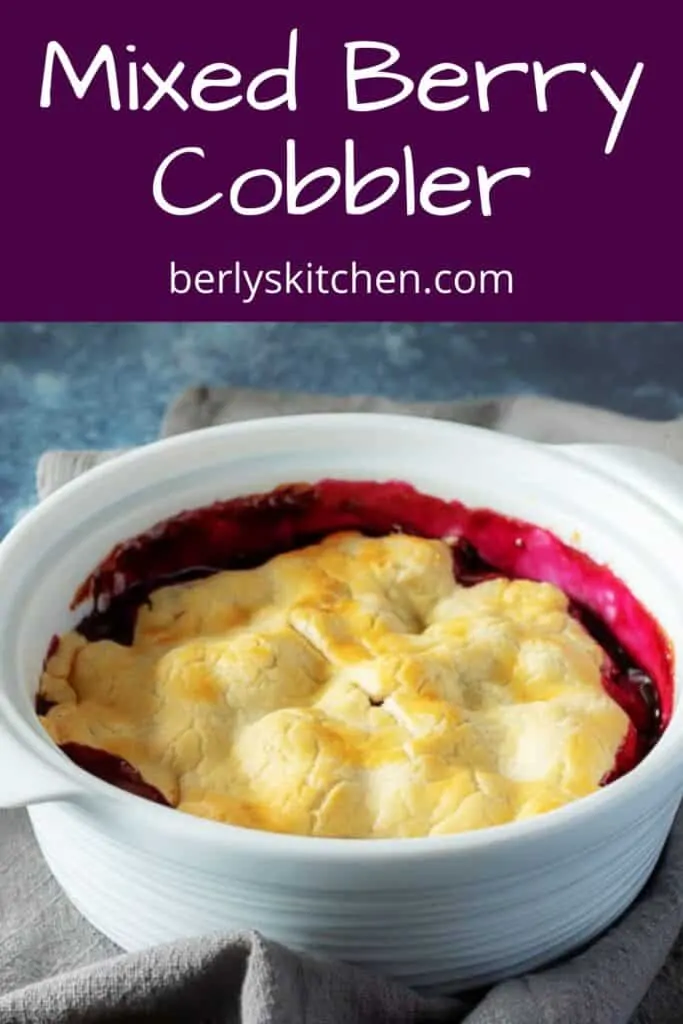 The baked mixed berry cobbler in large baking dish.