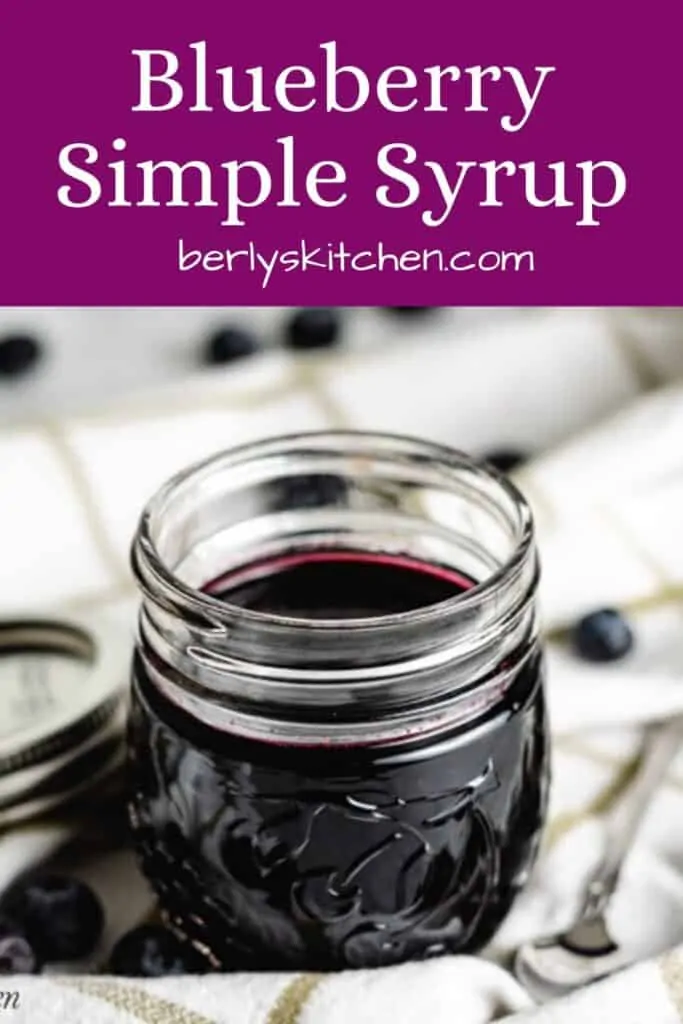 The finished blueberry simple syrup in a jar.