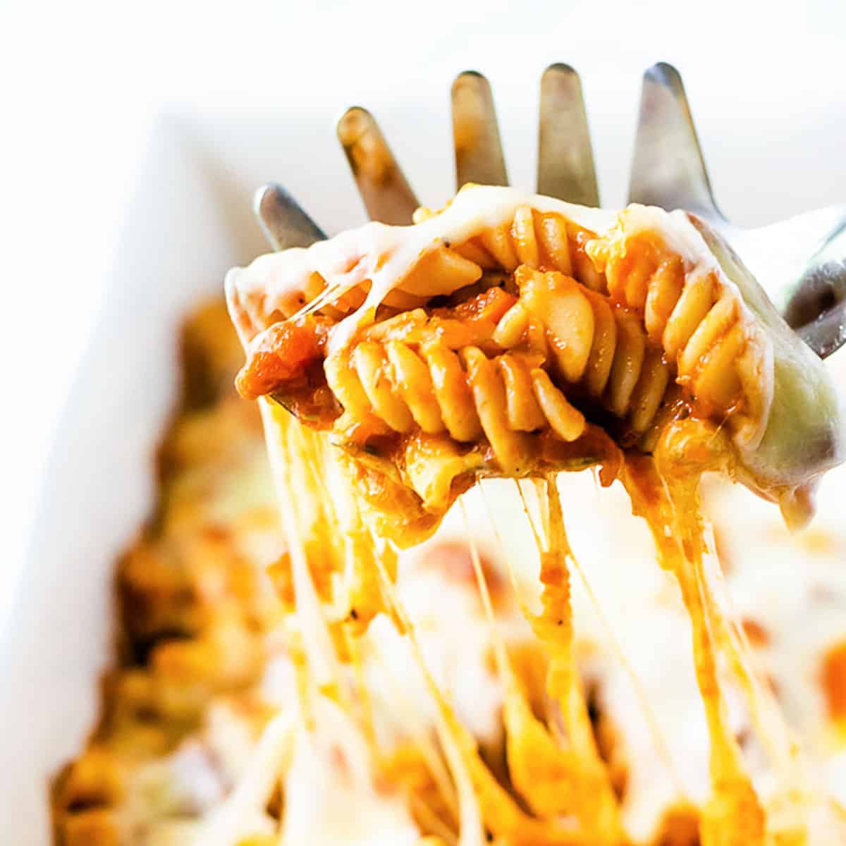 Pasta bake with cheese on a scoop.