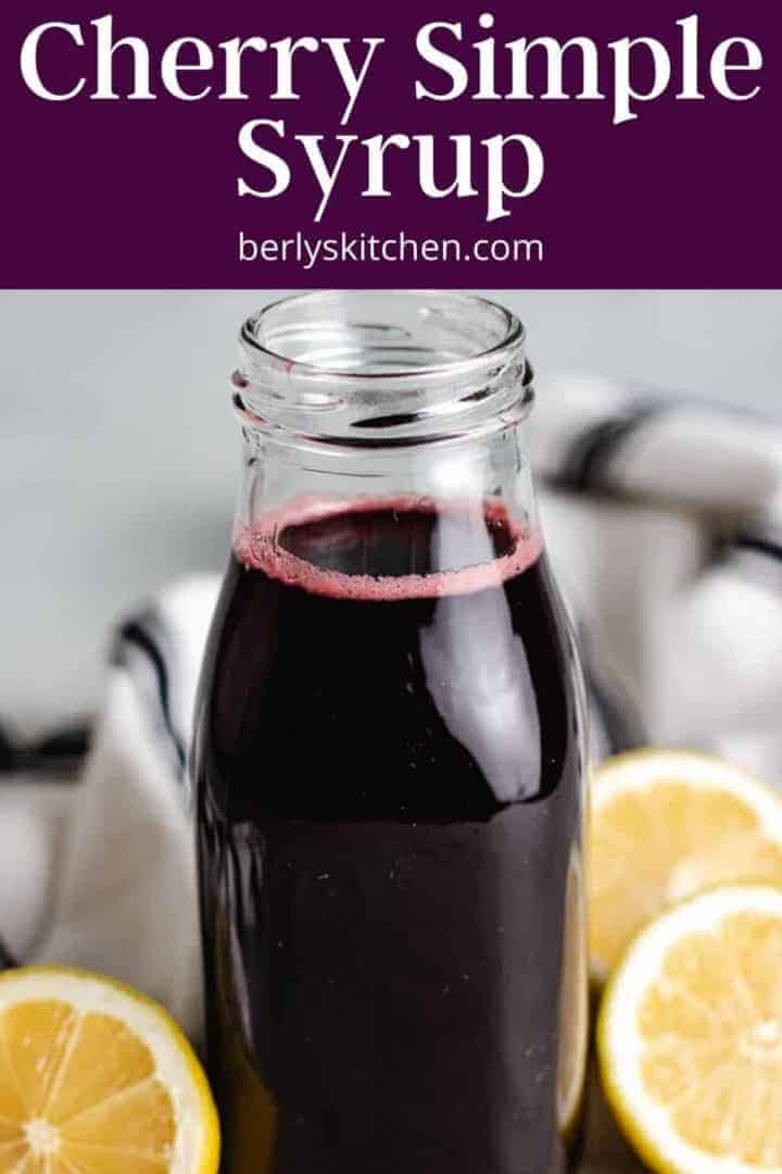 A close-up of the cherry drink syrup in a decorative bottle.