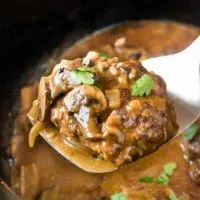 Salisbury steak on a spatula.